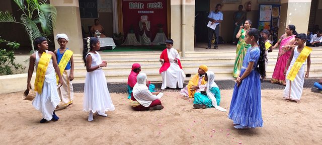 Performers in costume on the ground