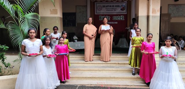 Students in costume on the school steps