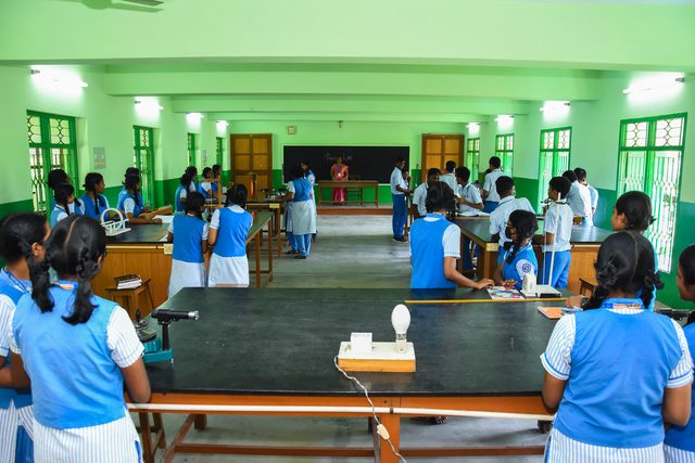 Students at work around the biology bench