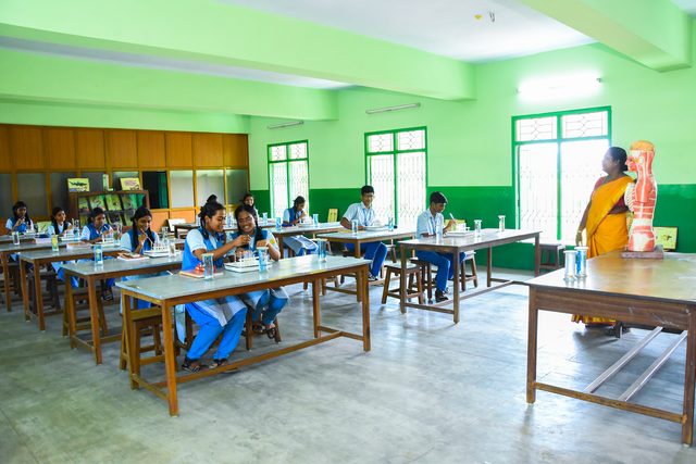 A biology practical class at the laboratory benches