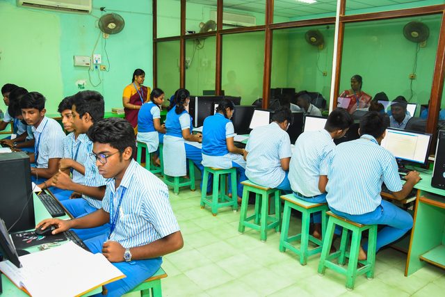 Students working at machines in the school computer laboratory