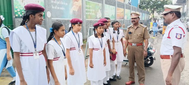 Traffic police speaking to the students