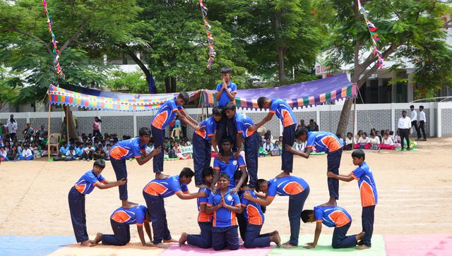 Students forming a pyramid during the sports meet drill display